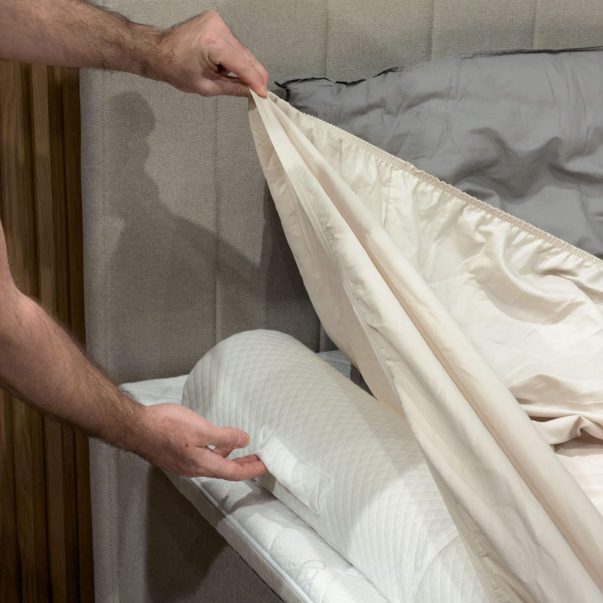 FamBed bed guard positioned securely under the sheet along the edge of the bed